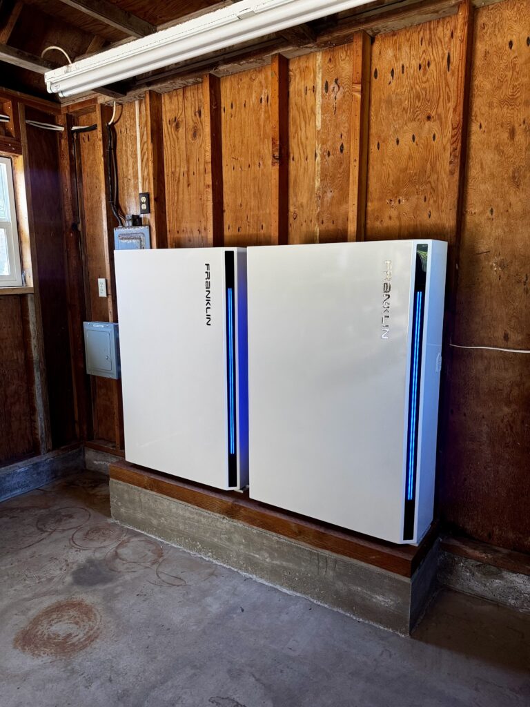 Two FranklinWH home batteries installed side by side inside a residential garage.